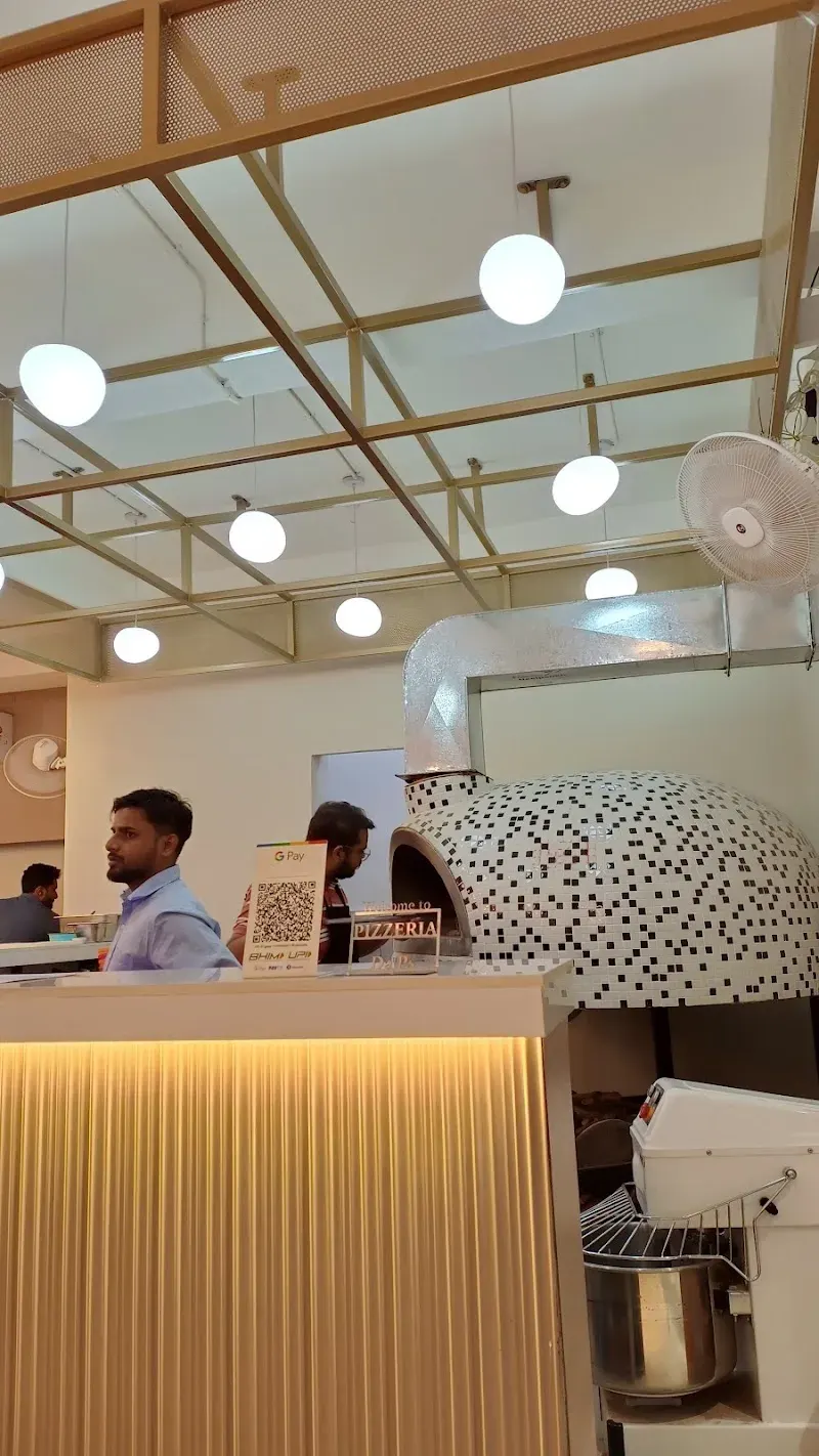 The mosaic oven behind the counter, seen from the dining room